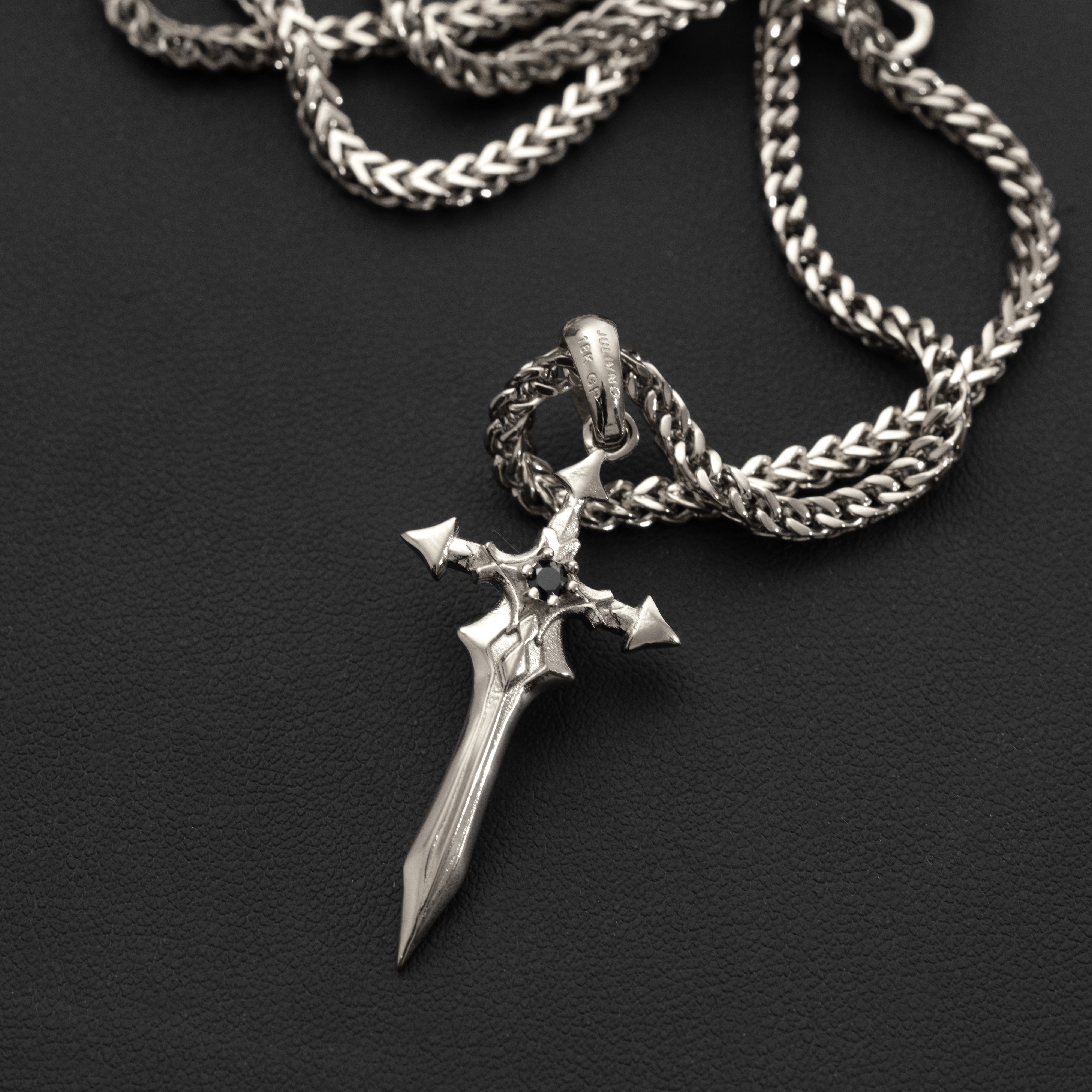 Close-up of Julivno Sword Pendant 35mm highlighting Black Zircon and sleek blade design in White Gold Plated finish