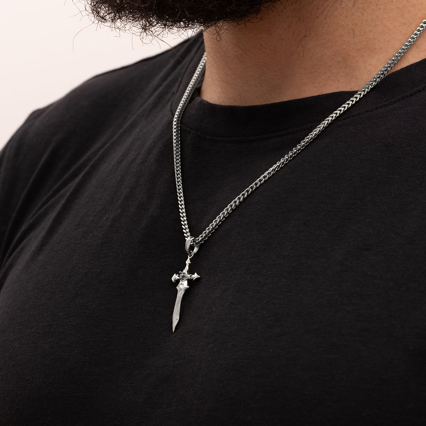 Men wearing Julivno Sword Pendant 35mm with White Gold Plated finish and Black Zircon