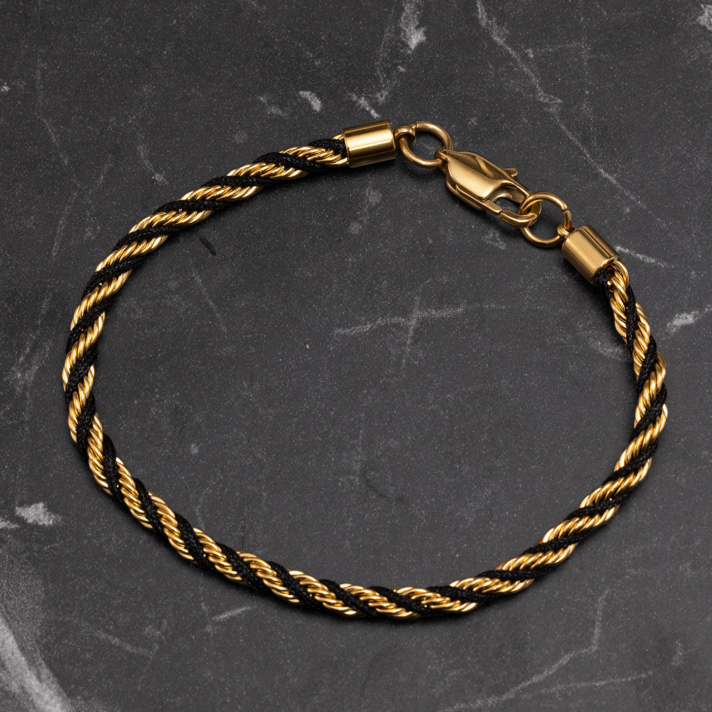 Close-up of Julivno twisted rope bracelet 4mm highlighting intricate twisted design and polished gold finish