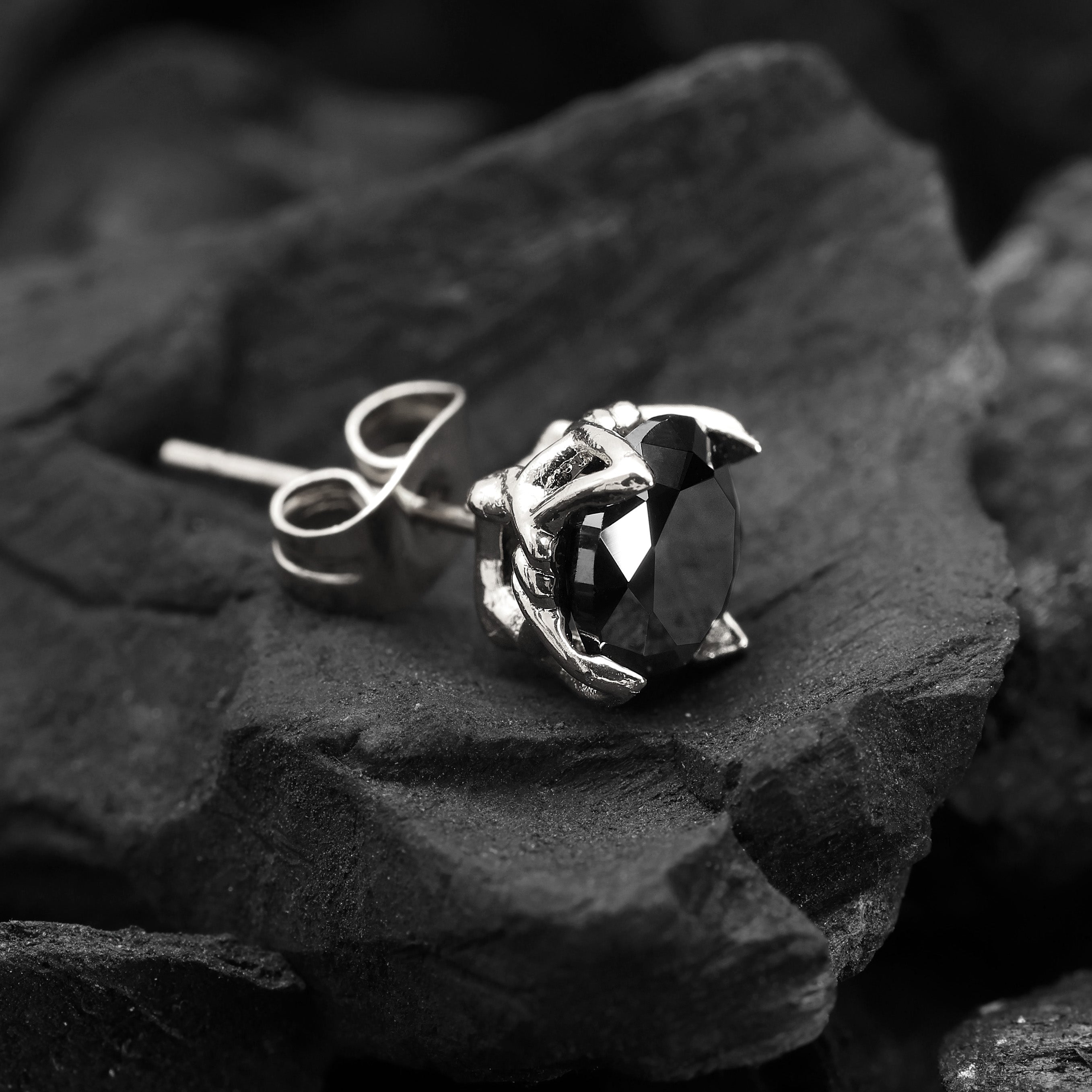 Close-up of Platinum Plated Crystal Stud Earring showing black zircon stone and angular geometric cut