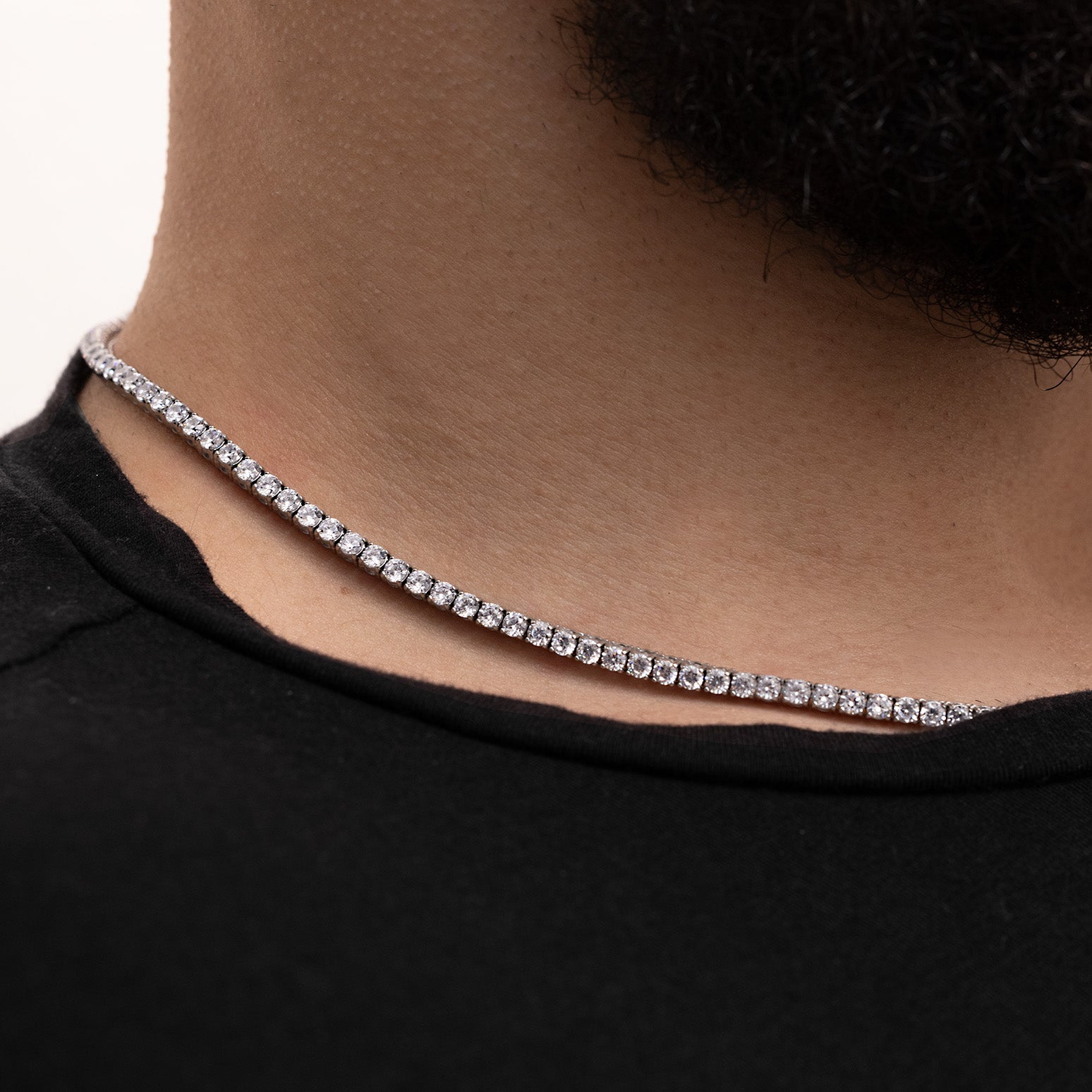 Close-up of White Gold Plated tennis chain showing continuous white zircon stone setting and brilliance
