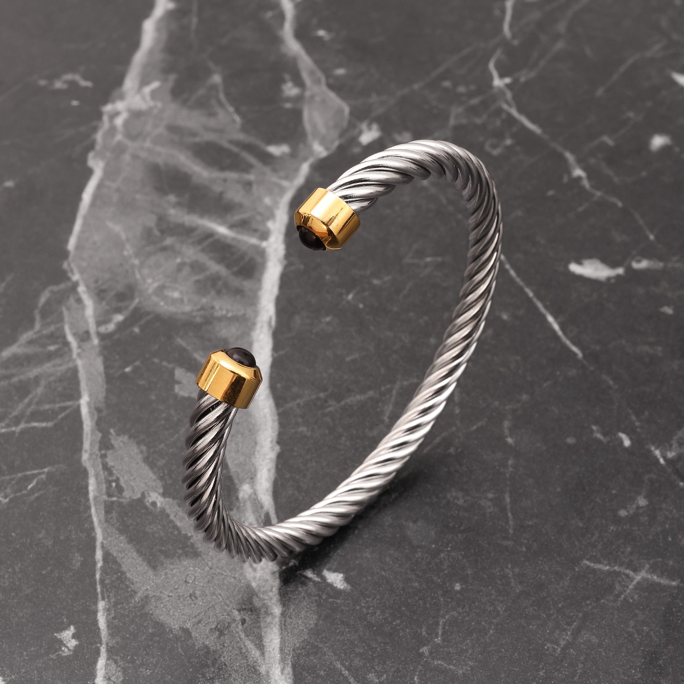 Close-up of 18K Platinum Plated twisted cable cuff showing spiral cable texture and polished finish