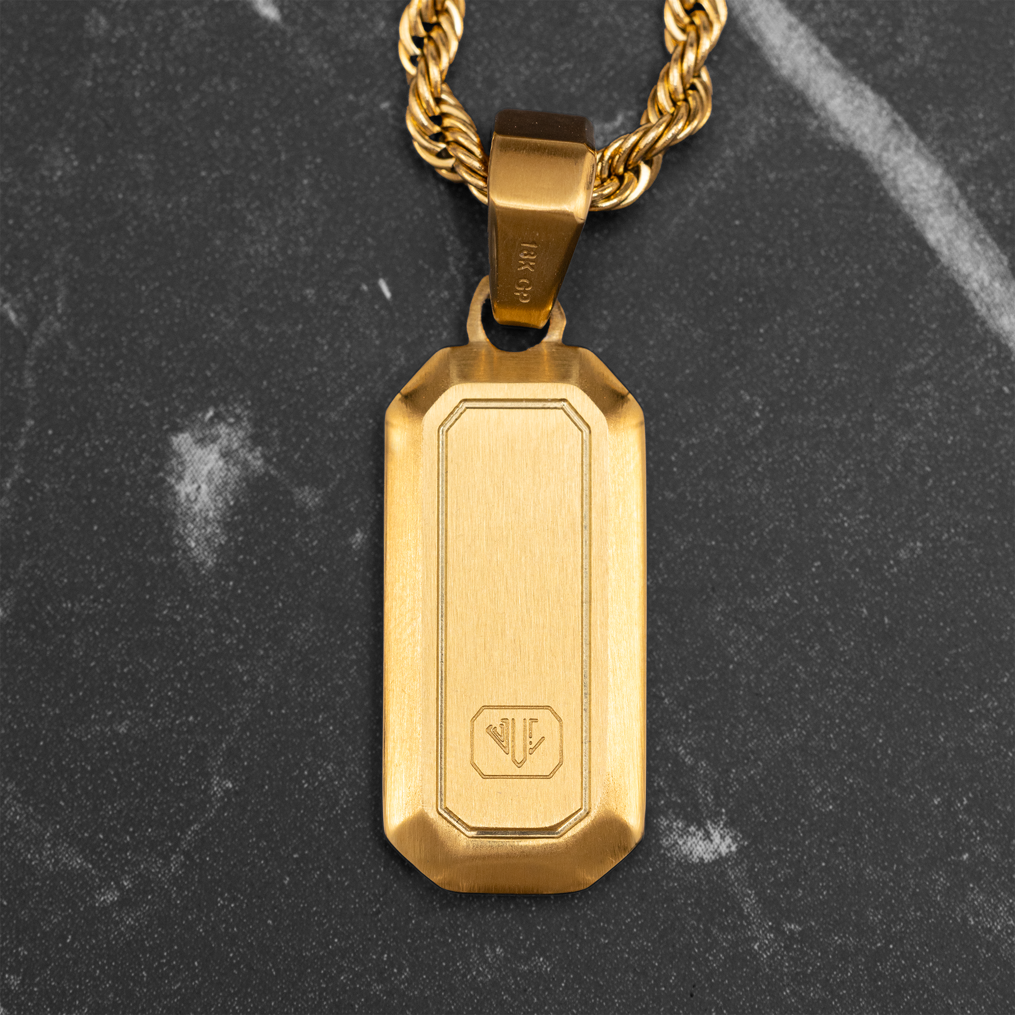 gold rectangle pendant men close up