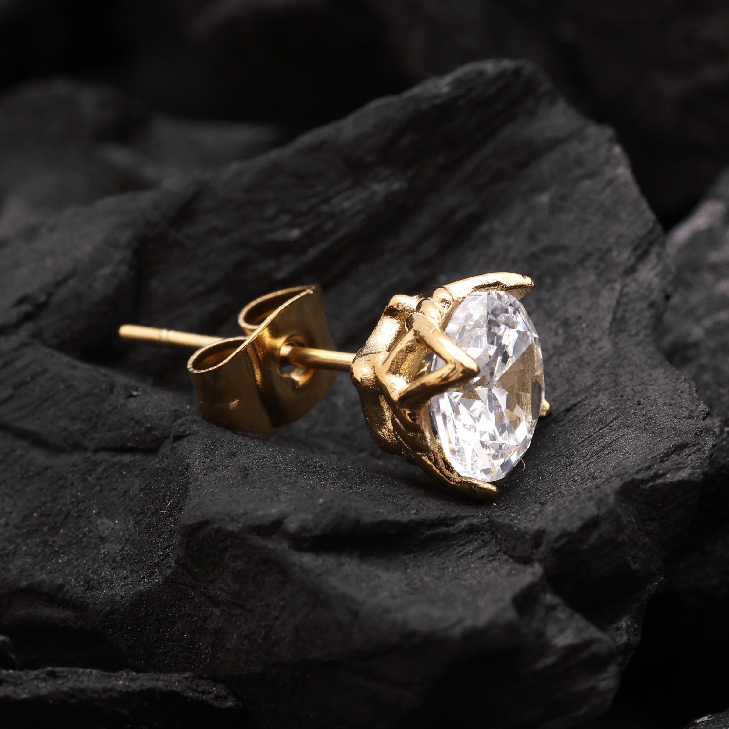 Close-up of Gold Plated Crystal Stud Earring showing white zircon stone and angular geometric cut
