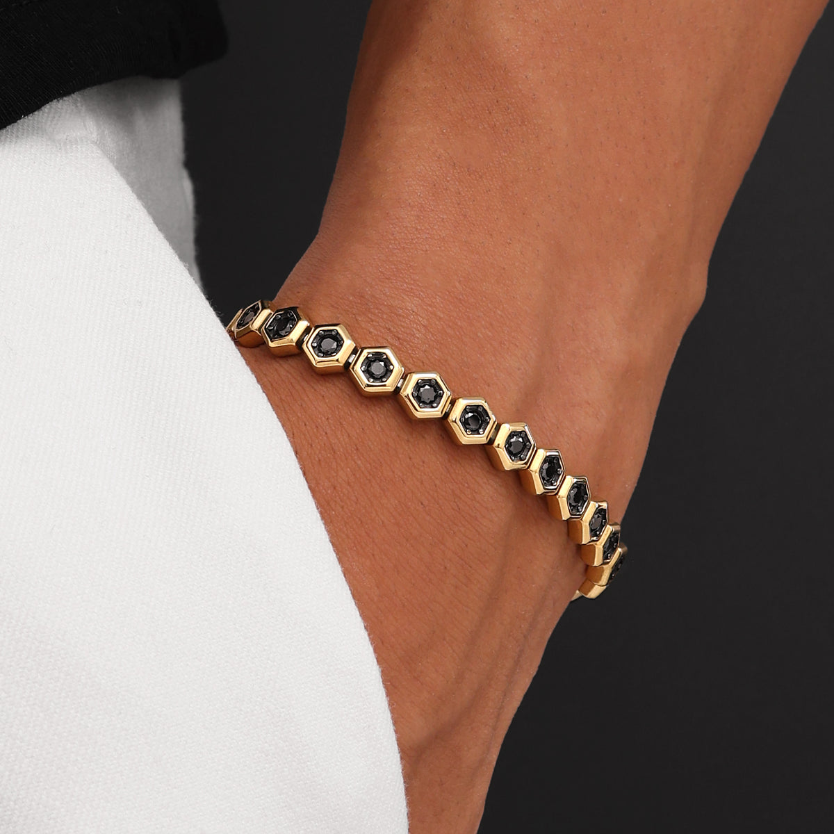 Close-up of 18K Gold Plated Hex Tennis Bracelet showing AAA+ black zircon stones, signature prong-set links, and polished gold finish