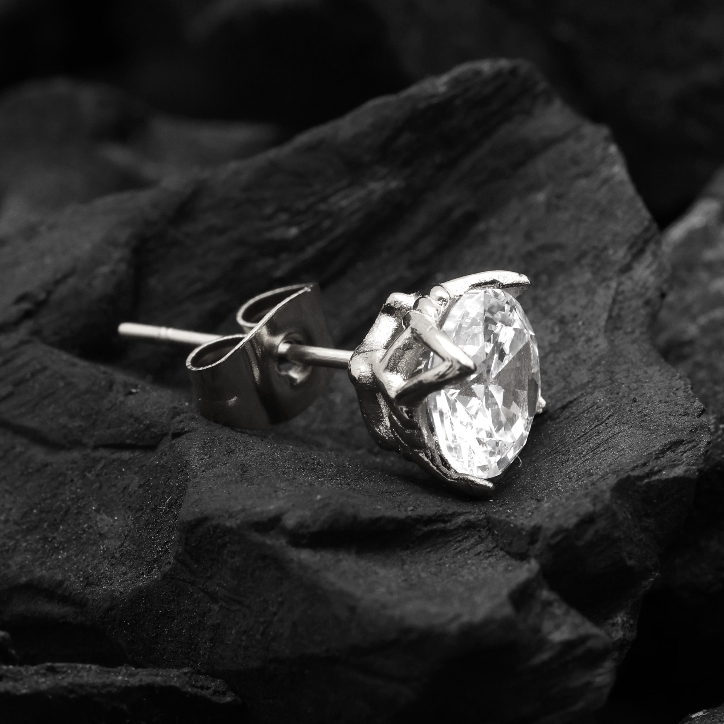 Close-up of Platinum Plated Crystal Stud Earring showing white zircon stone and angular geometric cut