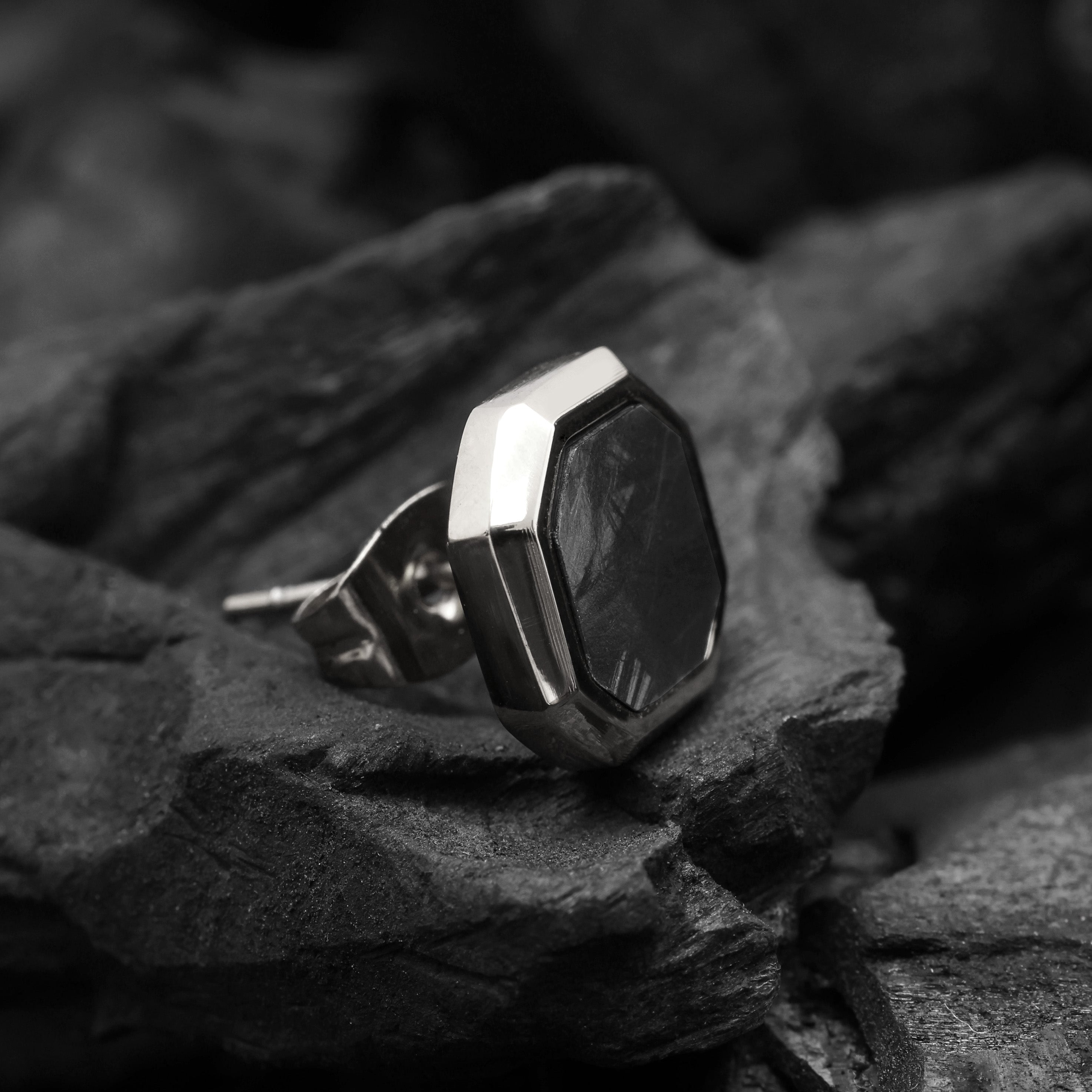 Close-up of Platinum Plated Hex Stud Earring showing matte black enamel and geometric hexagon design