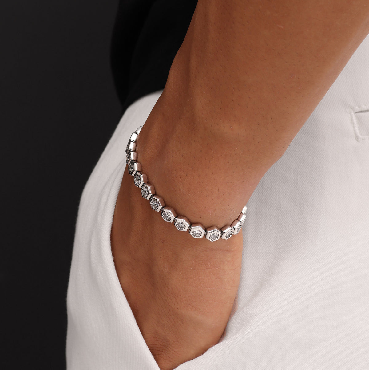 Platinum Plated Hex Tennis Bracelet 7.5mm with White Zircon worn on wrist premium men’s luxury tennis bracelet lifestyle view