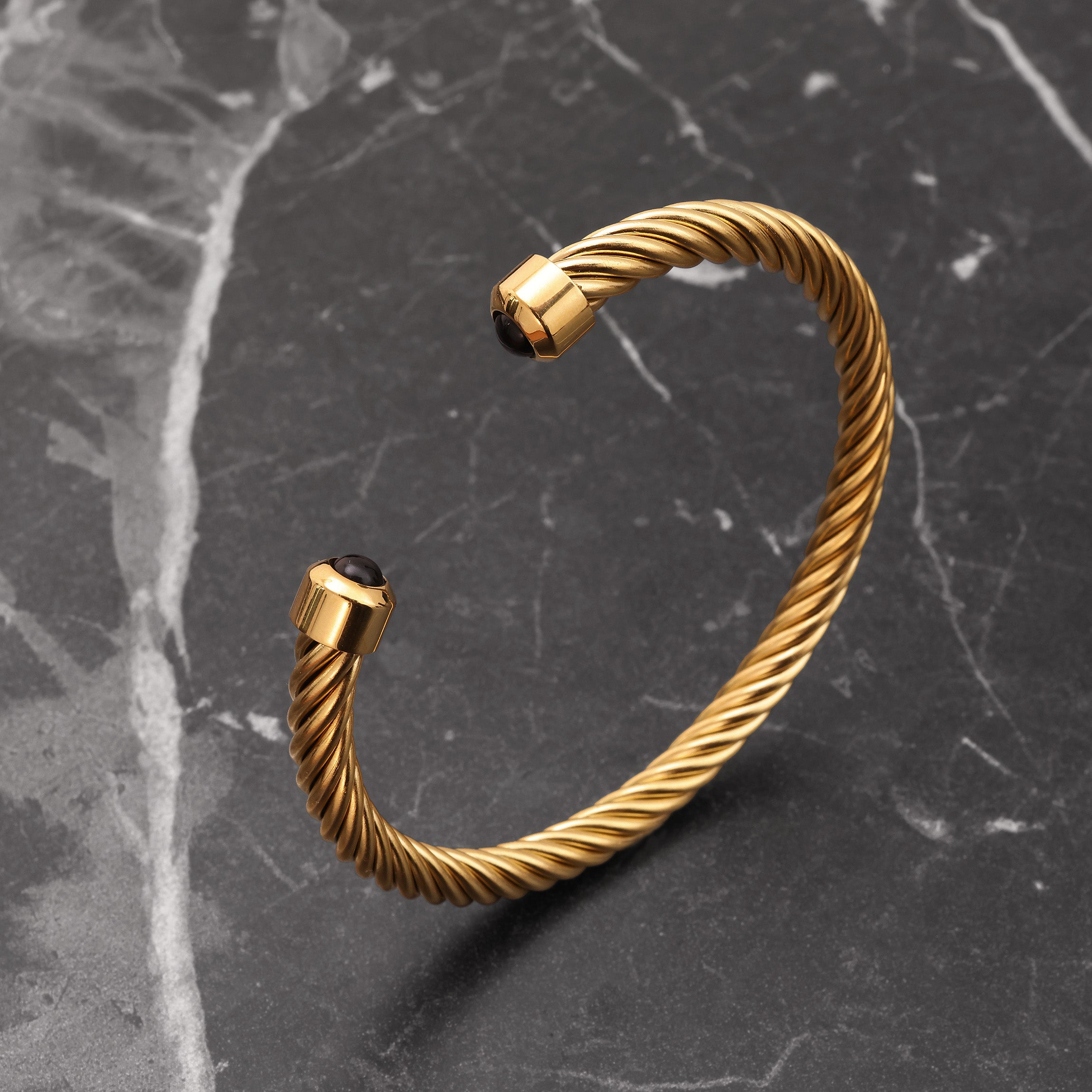 Close-up of 18K Gold Plated twisted cable cuff showing spiral cable texture and polished finish
