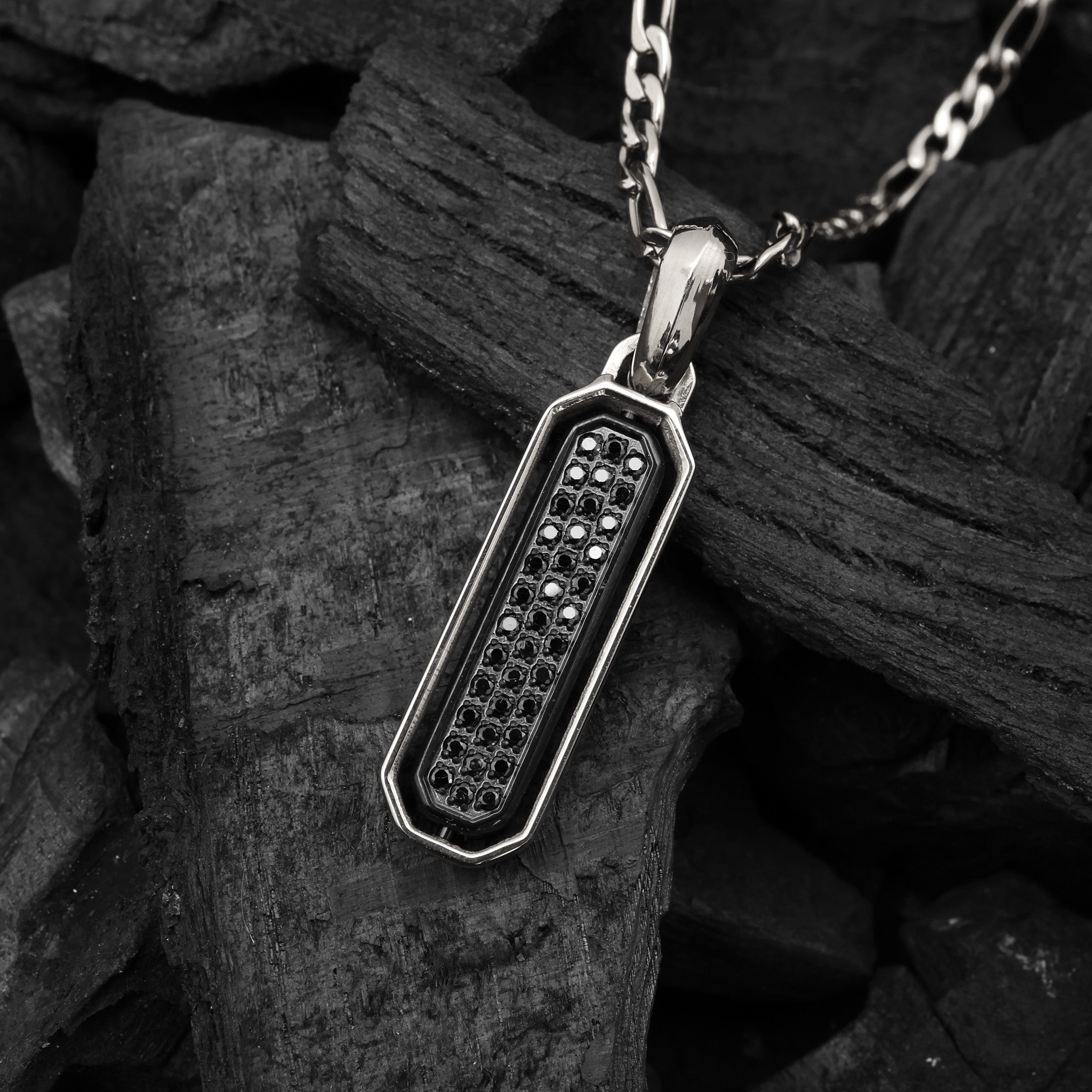 Close-up of Platinum Plated Diamond Flip Bar Pendant showing black zircon stone and hexagonal frame design